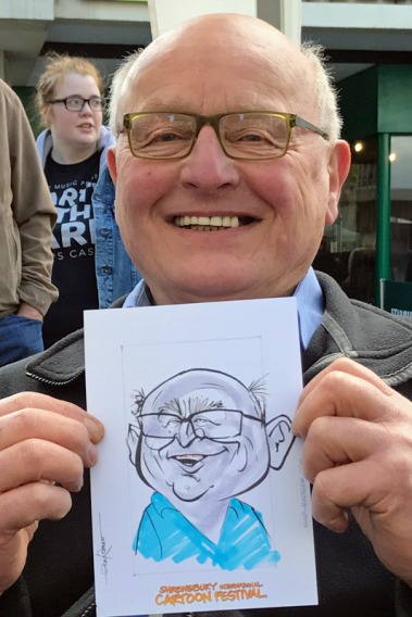 a happy customer with his caricature